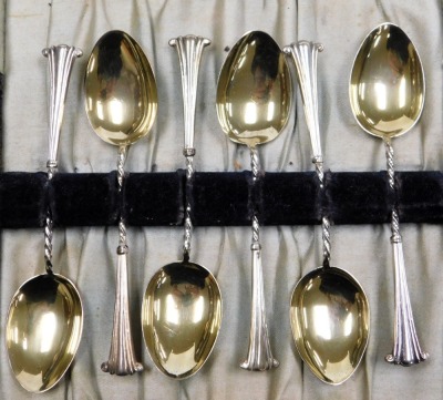 A set of six silver and silver gilt Albany pattern coffee spoons, cased, Birmingham 1908, 1.15oz. - 2