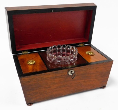 A Regency rosewood tea caddy, of sarcophagus form, with mother of pearl key escutcheon, the hinged lid opening to reveal two lidded compartments flanking a central recess with glass mixing bowl, raised on bun feet, 16cm high, 30cm wide, 15.5cm deep. - 2