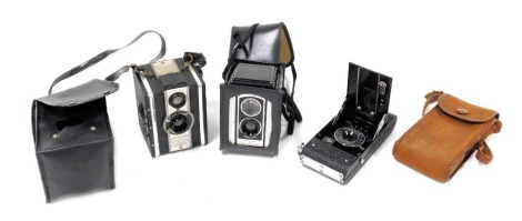 A Soho Myna all distance camera, Coronet Twelve-20 camera, and a Kodak Duaflex II camera, all cased. (3)