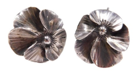 A pair of mid century silver earrings, of floral form, with screw fittings, stamped sterling.