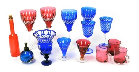 A group of continental table glass, including wine glasses, a faceted blue glass vase, atomiser and three cranberry custard glasses. (qty)