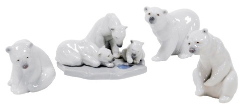 Three Llado porcelain figures of polar bears, and a figure group of two polar bears and a cub peering into a water hole. (4)