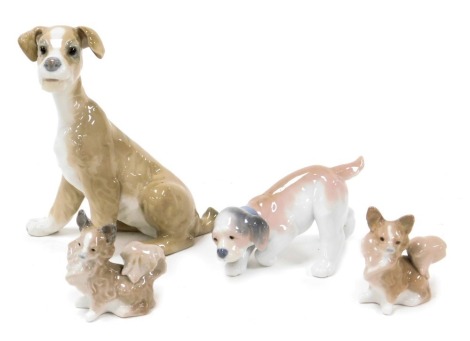 A Llardo porcelain figure of a seated dog, another of a playful puppy, and two figures of chihuahuas. (4)