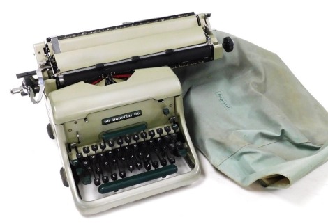 An Imperial 66 two tone green typewriter, with protective bag.