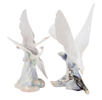 A Lladro porcelain figure of a dove, 29cm high, together with a Nao porcelain figure of two flying herons. (2)