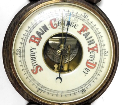 A Victorian oak barometer, with thermometer, within a carved case, 80cm high. - 2