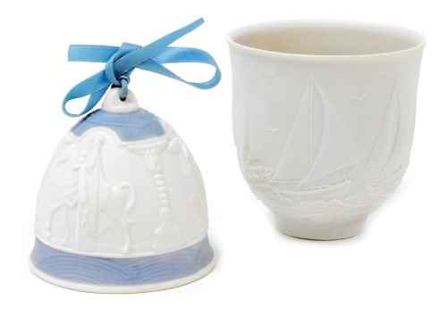 A Lladro bisque porcelain candle holder, Sailing the Seas, Collectors Society edition 1997, boxed, together with a Lladro Christmas bell, 1990. (2)