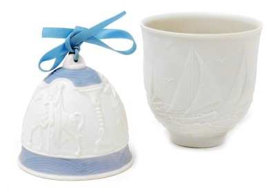 A Lladro bisque porcelain candle holder, Sailing the Seas, Collectors Society edition 1997, boxed, together with a Lladro Christmas bell, 1990. (2)