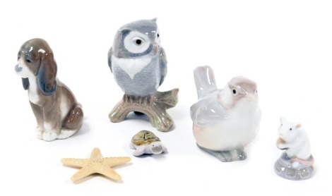 A Lladro porcelain figure of a starfish, a dormouse, an owl, seated dog, and a wren. (5)