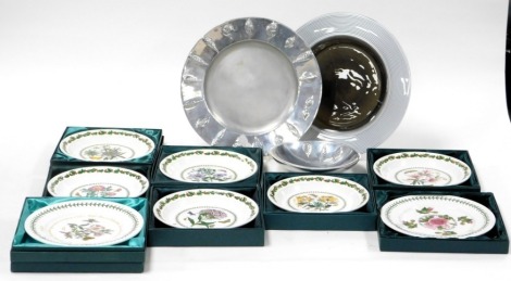 A Portmeirion Futtura silver and black glass platter, 34cm wide, Portmeirion metal platter, embossed with leaves, 34cm wide, a metal bowl, six Portmeirion Christmas plates, and thee further plates, all boxed. (12)