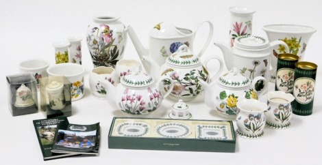 A group of Portmeirion pottery, including teapots, a watering can, vases, candle holders, a dish set, and ornaments. (a quantity)