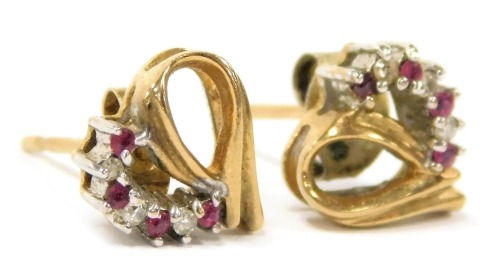 A pair of ruby and diamond earrings, in a heart shaped open setting, stamped 9k, 1.6g.