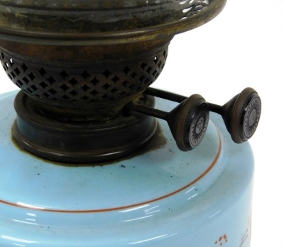 An early 20thC cast iron oil lamp, with a turquoise glass reservoir, painted with flowers, glass chimney and etched glass shade, 54.5cm high. - 2