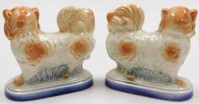 A pair of late 19thC pottery figures of Pekingese, naturalistically modelled on an oval base, 21cm wide. - 2