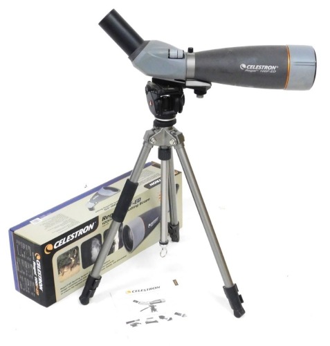 A Celestron Regal 100F-ED spotting scope, 100mm APO, model 52303, boxed with instructions, and a tripod.