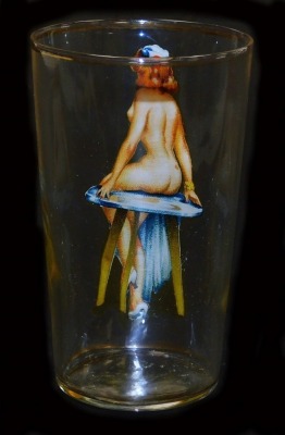 A mid century risque glass tumbler printed with a lady seated upon a table, internally naked, 12cm high. - 2