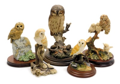 Four Border Fine Arts sculptures of owls, including A Watchful Eye, and Barn Owl on Wheel, together with a Country Artists sculpture of a tawny owl with mice, all with wooden stands. (5)