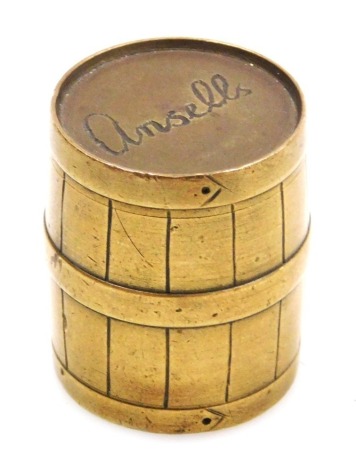 An early 20thC Ansells brass weight, formed as a barrel, engraved to top "Ansells" and to base "XXX", 3cm high.