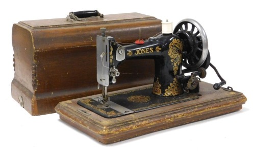 A Jones Family C.S sewing machine, serial number B581596, wooden cased.