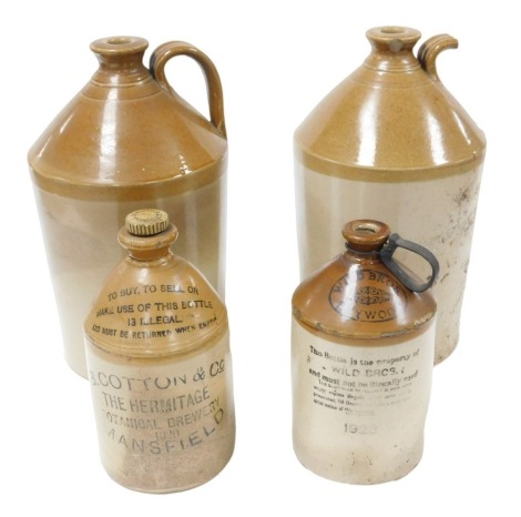 A pair of late 19thC two tone stoneware flagons, 37cm high, together with a jar for B Cotton and Company, The Hermitage Botanical Brewery, Mansfield 1920, and a further flagon for Wild Bros. Heywood, 1923. (4)(AF)