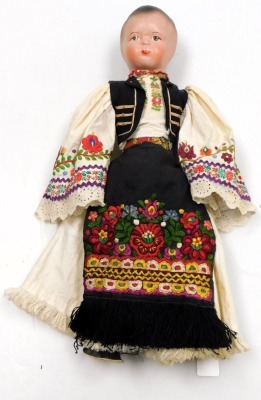 A 20thC Hungarian doll, dressed in traditional costume, with a cloth body, 51cm high. - 2