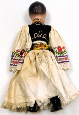 A 20thC Hungarian doll, dressed in traditional costume, with a cloth body, 51cm high. - 3