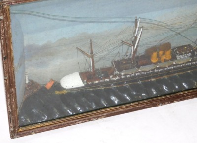 A late 19thC diorama of a sailing ship "India", modelled with three masts, sails furled and under steam, with figures on the decks, on a sea with lighthouse and blue sky beyond, glass and wooden cased, case 40cm high, 79cm wide. - 3