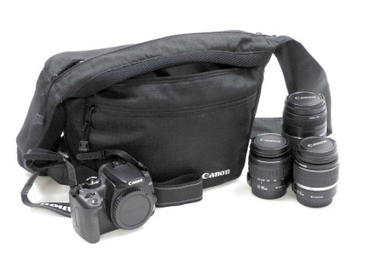 A Canon EOS camera 400D, with additional lenses in a holdall.