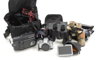 A Canon EOS 300V camera, JVC compact VHS camera 50X, a Tomtom and pair of Bushnell camouflage binoculars, 60x60. (4)