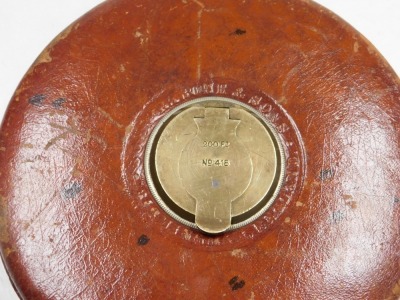 A Rabone 200ft tape measure, leather cased, number 418, together with a Rabone folding ruler. (2) - 9