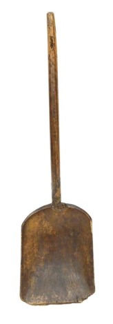 A 19thC wooden corn shovel, 107cm high.