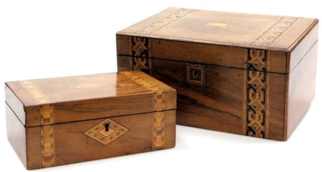 A Victorian walnut and inlaid workbox, with marquetry inlay, the hinged lid opening to reveal a fitted tray, 17cm high, 33cm wide, 24.5cm deep, and a similar smaller box, with a vacant interior, 10cm high, 25cm wide, 15.5cm deep. (2)