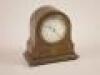 *An Edwardian mahogany and marquetry mantel timepiece