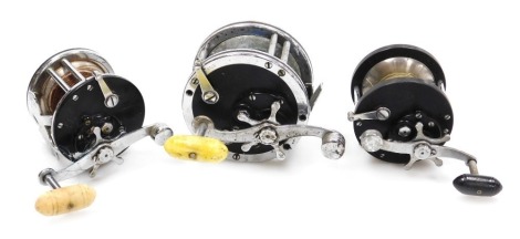 Penn number 49 Super Mariner multiplier sea fishing reel, and two other Penn reels, including a Penn 60 and a Penn number 285. (3)