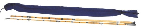 A vintage bamboo two piece sea fishing rod, with composite cork handle and ceramic lined rings, 58cm long.