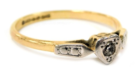 An 18ct gold and diamond solitaire ring, in a heart shaped setting, size Q, 2.4g.