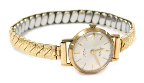 A Rotary lady's 9ct gold cased wristwatch, circular silvered dial with batons, twenty one jewelled movement, on a plated strap.