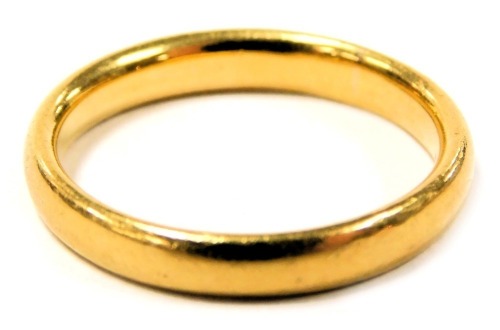 A 22ct gold wedding band, size P, 5.7g.