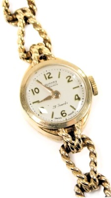 A Rotary Maximus lady's 9ct gold cased wristwatch, circular silver dial with Arabic numerals at evens, twenty one jewelled movement, on a fancy link bracelet strap, 14.9g all in.