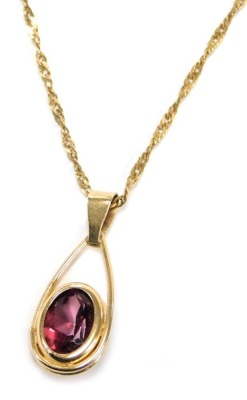 A 9ct gold and amethyst pendant, on a neck chain, with bolt ring clasp, 1.8g.