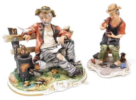 A Capodimonte porcelain figure of a tramp, seated against a fence, with a wood burner and birds, on a rococo base, with certificate, 27cm wide, and a further figure of a cobbler, with certificate, 25cm high. (2)