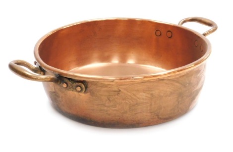 A Victorian twin handled copper preserve pan, 52cm wide.