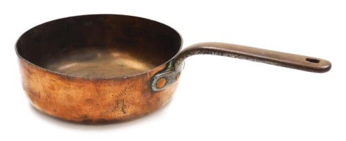 A 19thC copper saucepan, with a cast iron handle, engraved with a baronial coronet above the letter H, 26cm wide.