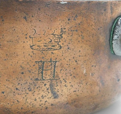 A 19thC copper saucepan, with a cast iron handle, engraved with a baronial coronet above the letter H, 26cm wide. - 2