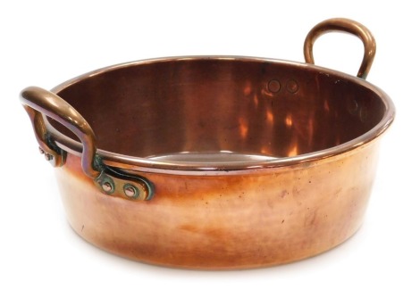 A 19thC twin handled copper preserving pan, 38cm wide.