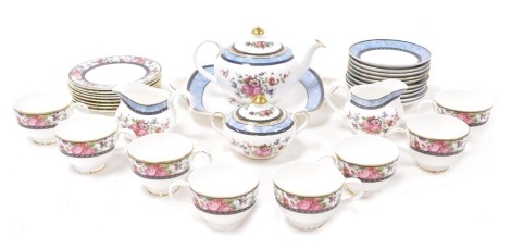 A Royal Doulton porcelain Centennial Rose pattern part tea service, comprising teapot, cream jug, sucrier, bread plate, eight teacups, ten saucers and eight tea plates.