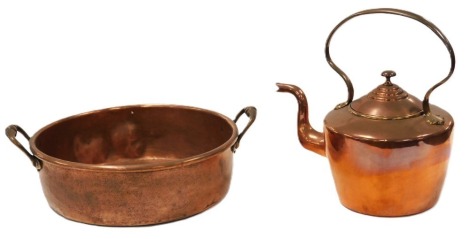 A Victorian copper preserving pan, with twin brass handles, 45cm wide, together with a copper kettle. (2, AF)