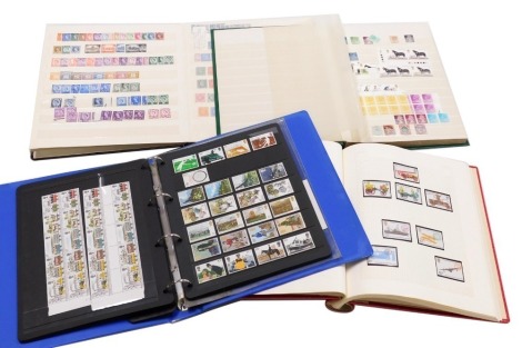 Philately. GV-EII, definitives and commemoratives, mint, including some blocks, and world stamps, in four albums.