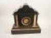 A French black slate and variegated marble mantel clock