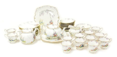 An early 20thC Paragon porcelain Merrivale pattern porcelain tea service, comprising teapot, lidded hot water jug, cream jug, sugar bowl, pair of bread plates, twelve teacups, saucers and plates.